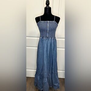 Denim stone washed dress with thin straps.